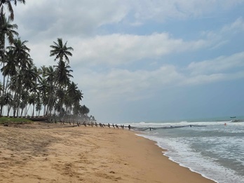 Fishermen hauling fishing nets, Ghana